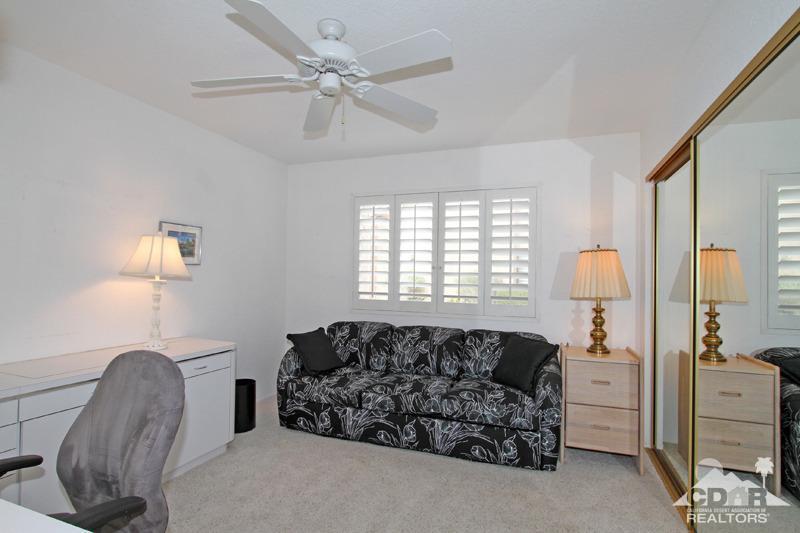 52 Maximo Way Palm Desert, CA 92260 - Photo 15 of 20 a living room with furniture a lamp and a chandelier
