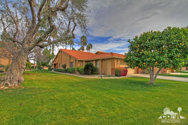 52 Maximo Way Palm Desert, CA 92260 - Photo 16 of 20 a front view of a house with a garden
