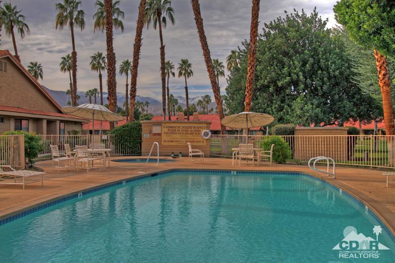 52 Maximo Way Palm Desert, CA 92260 - Photo 20 of 20 a view of a swimming pool with a yard and palm trees