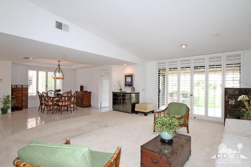 52 Maximo Way Palm Desert, CA 92260 - Photo 3 of 20 a living room with furniture and a large window