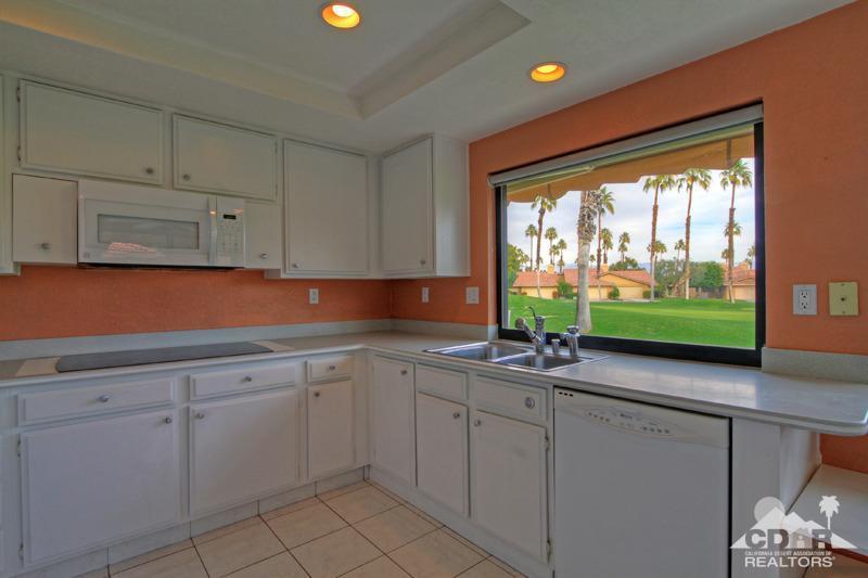52 Maximo Way Palm Desert, CA 92260 - Photo 7 of 20 a kitchen with white cabinets and window