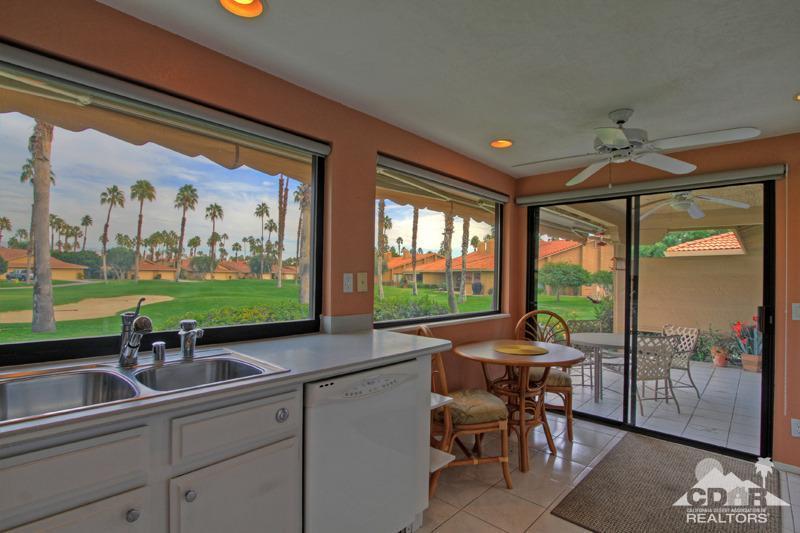 52 Maximo Way Palm Desert, CA 92260 - Photo 8 of 20 a view of a livingroom with furniture and garden view