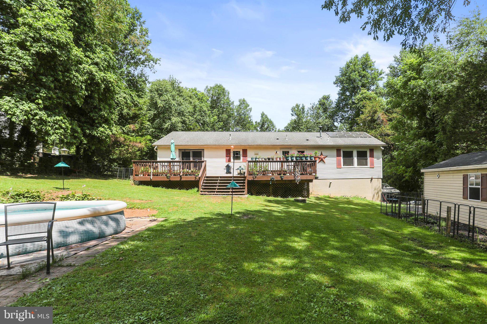 964 Aubel Road Delta, PA 17314 - Photo 39 of 45 a view of house with backyard porch and sitting area