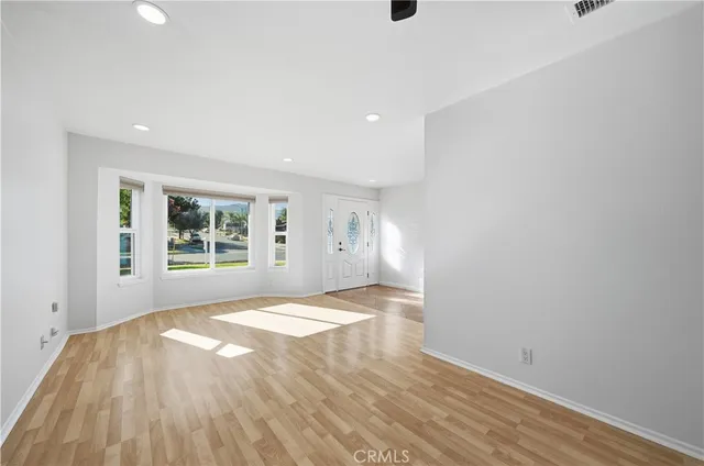 a view of an empty room and window