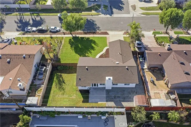 an aerial view of houses with outdoor space