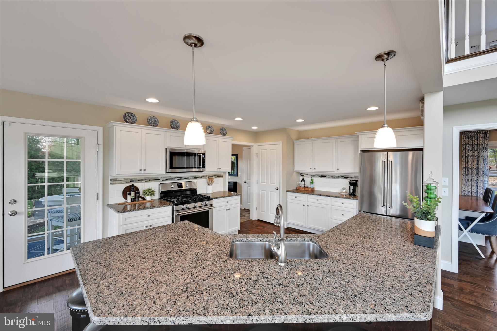 495 South Mill Street Lebanon, PA 17042 - Photo 11 of 54 a kitchen with stainless steel appliances granite countertop a sink refrigerator and stove