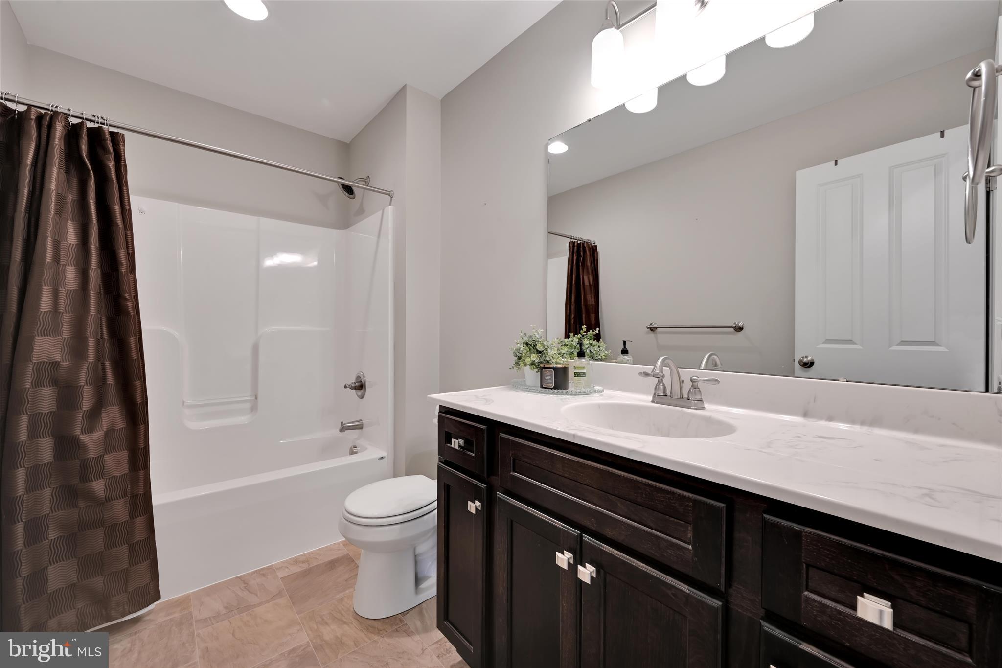 495 South Mill Street Lebanon, PA 17042 - Photo 32 of 54 a bathroom with a granite countertop sink a toilet and shower