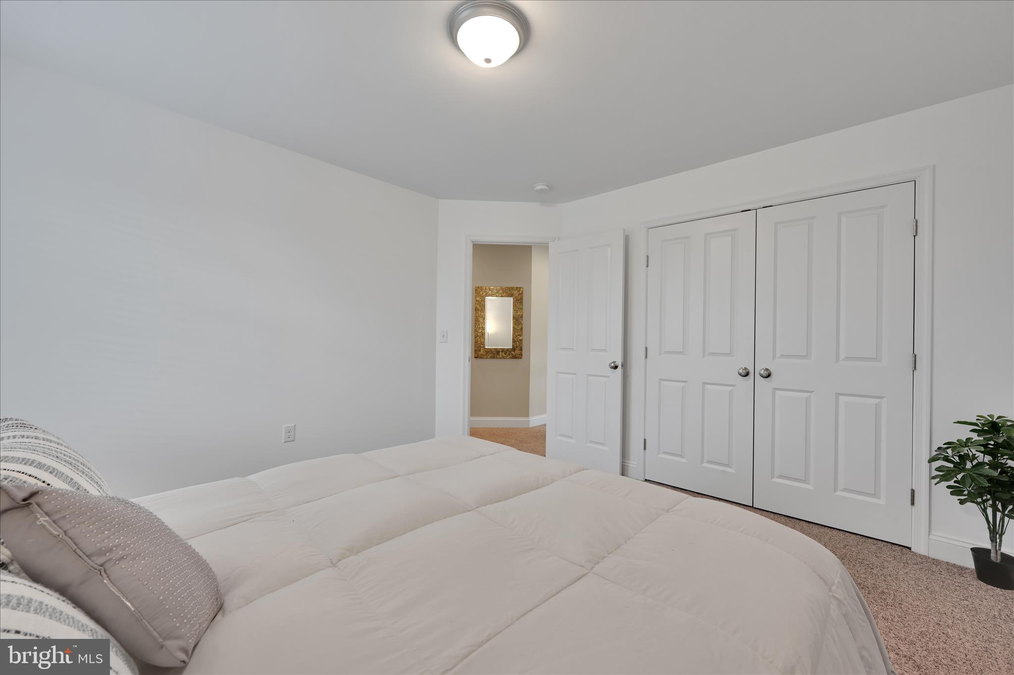 495 South Mill Street Lebanon, PA 17042 - Photo 34 of 54 a bedroom with a bed and a potted plant