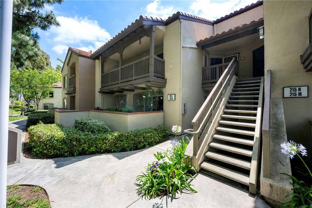 215 South Cross Creek Road, Unit L Orange, CA 92869 - Photo 2 of 50 a front view of a house with plants