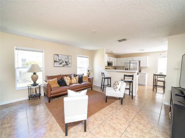 a living room with furniture and a table