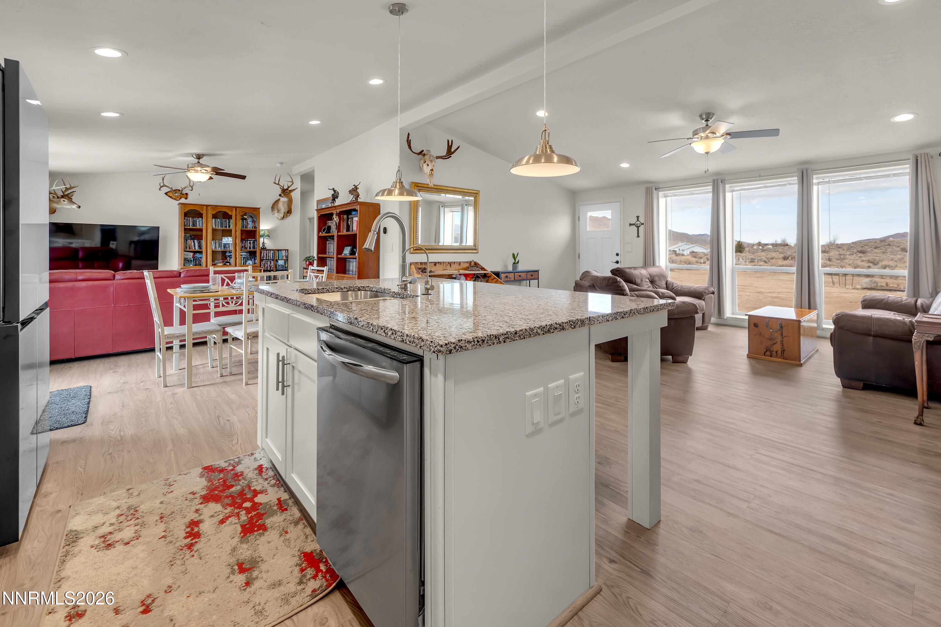 105 Arabian Way Reno, NV 89508 - Photo 11 of 40 a kitchen with counter top space and living room