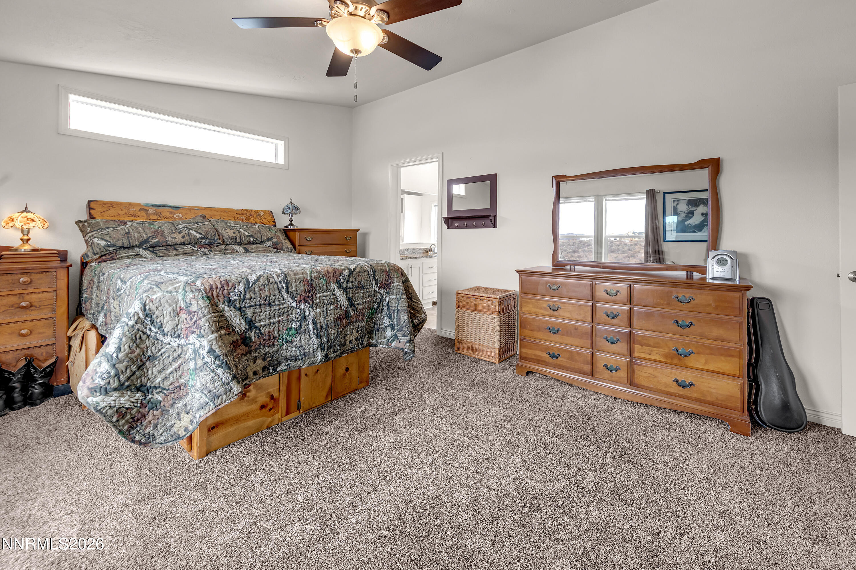 105 Arabian Way Reno, NV 89508 - Photo 17 of 40 a bedroom with a bed and a cabinets