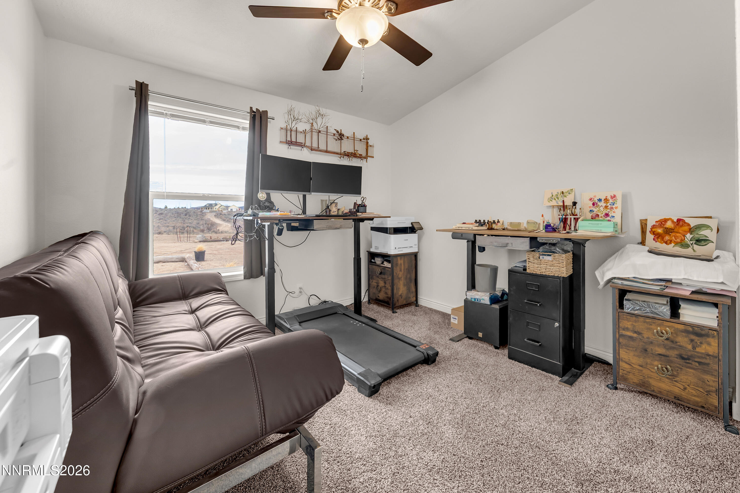 105 Arabian Way Reno, NV 89508 - Photo 19 of 40 a living room with furniture a flat screen tv and a fireplace