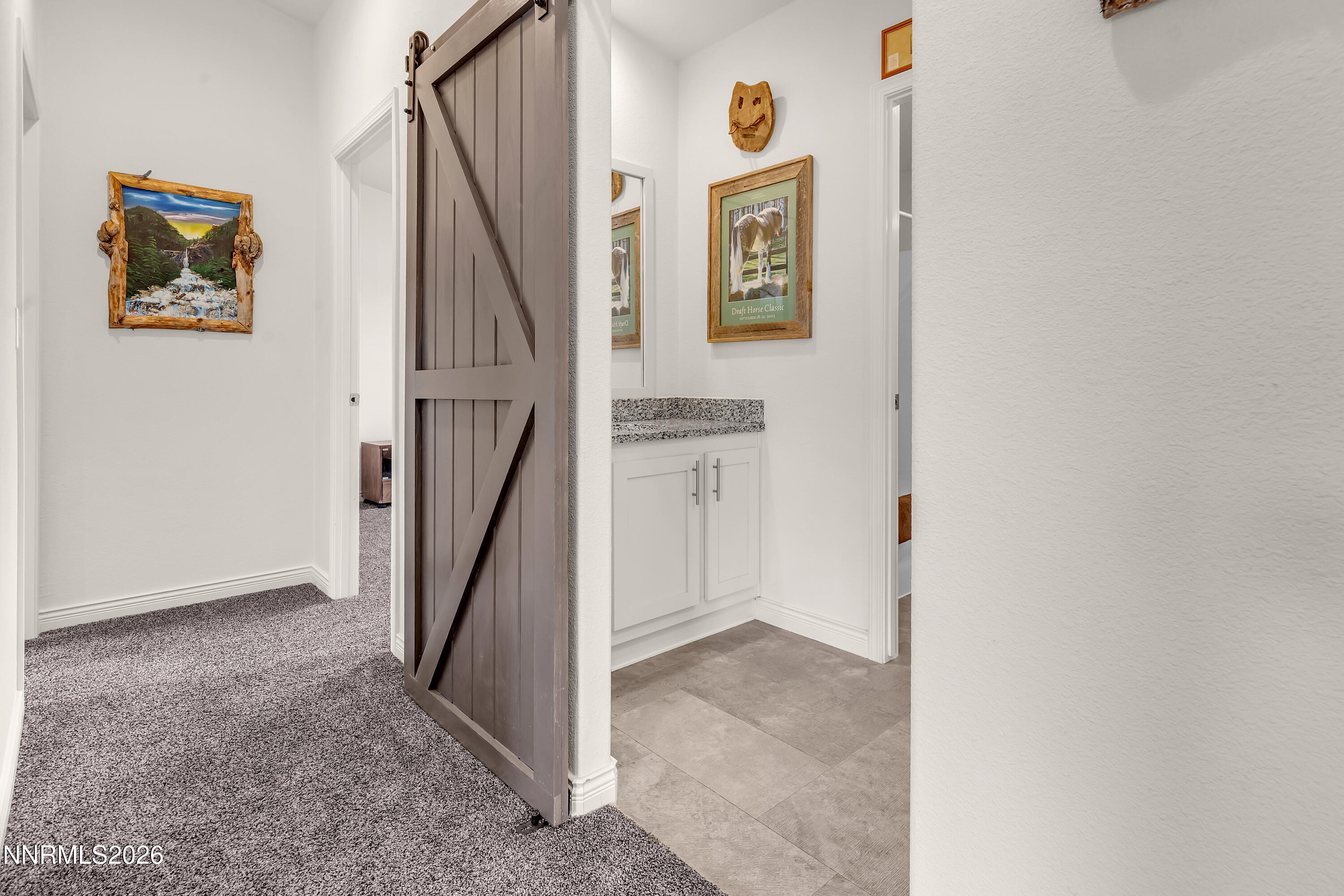 105 Arabian Way Reno, NV 89508 - Photo 21 of 40 a view of hallway with stairs and wooden floor
