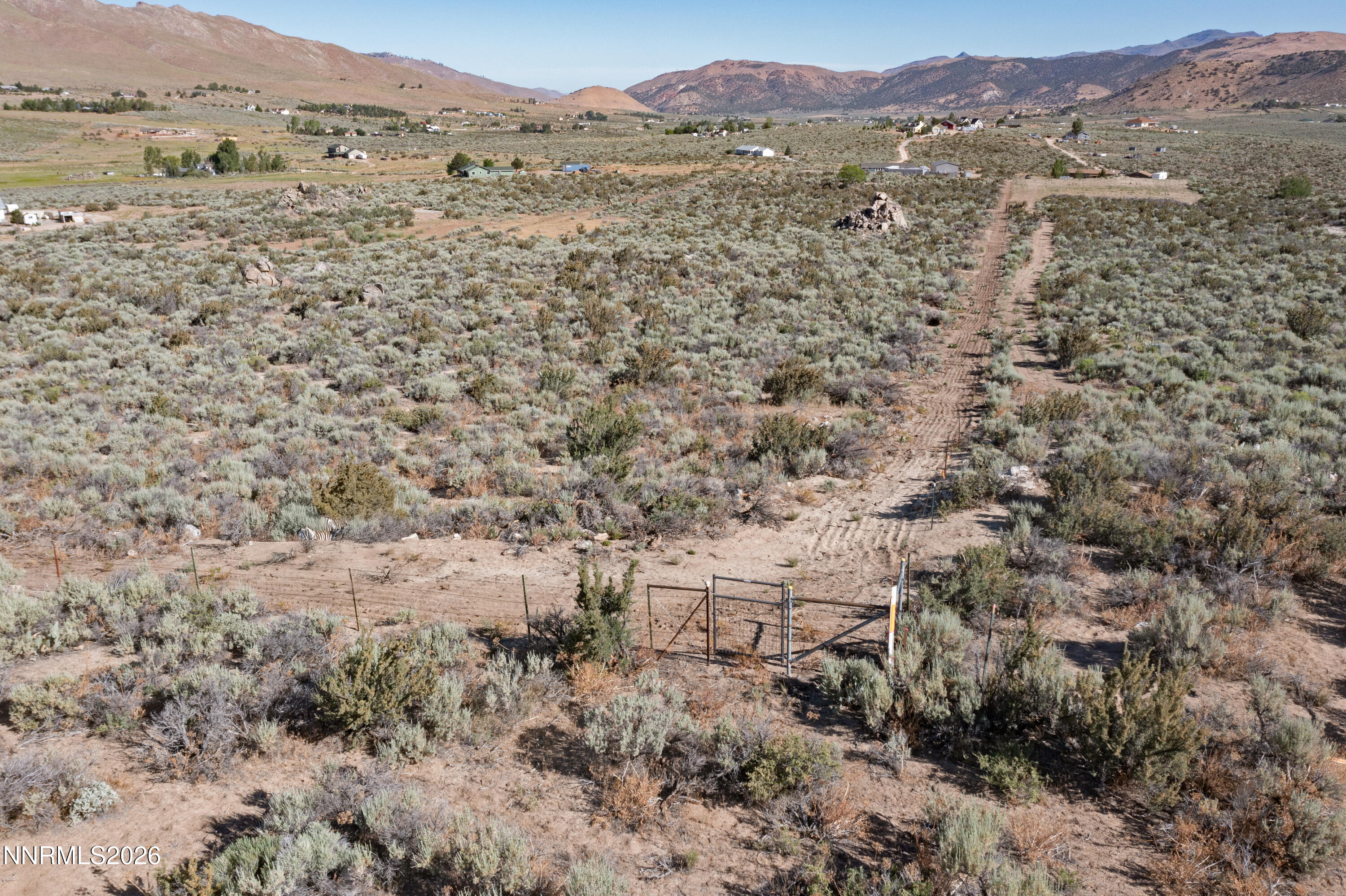 105 Arabian Way Reno, NV 89508 - Photo 39 of 40 a view of a field with mountains in the background