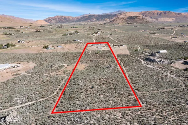 a kitchen with counter top space and living room