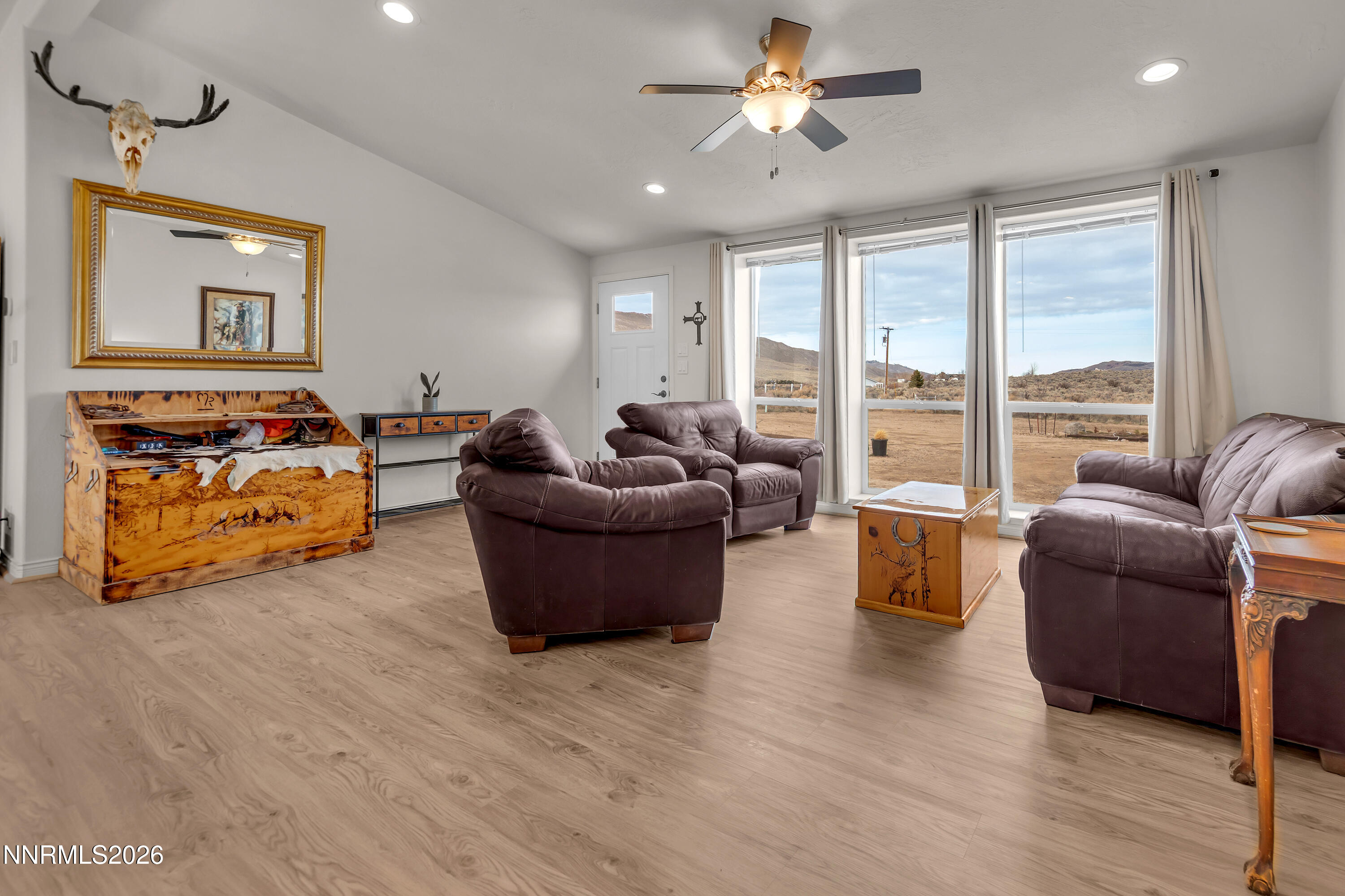 105 Arabian Way Reno, NV 89508 - Photo 8 of 40 a living room with furniture and a large window