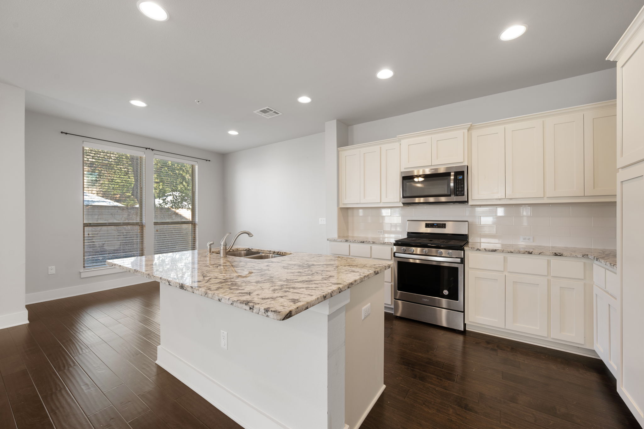 13800 Lyndhurst Street, Unit 326 Austin, TX 78717 - Photo 13 of 39 a kitchen with a stove a sink and a refrigerator