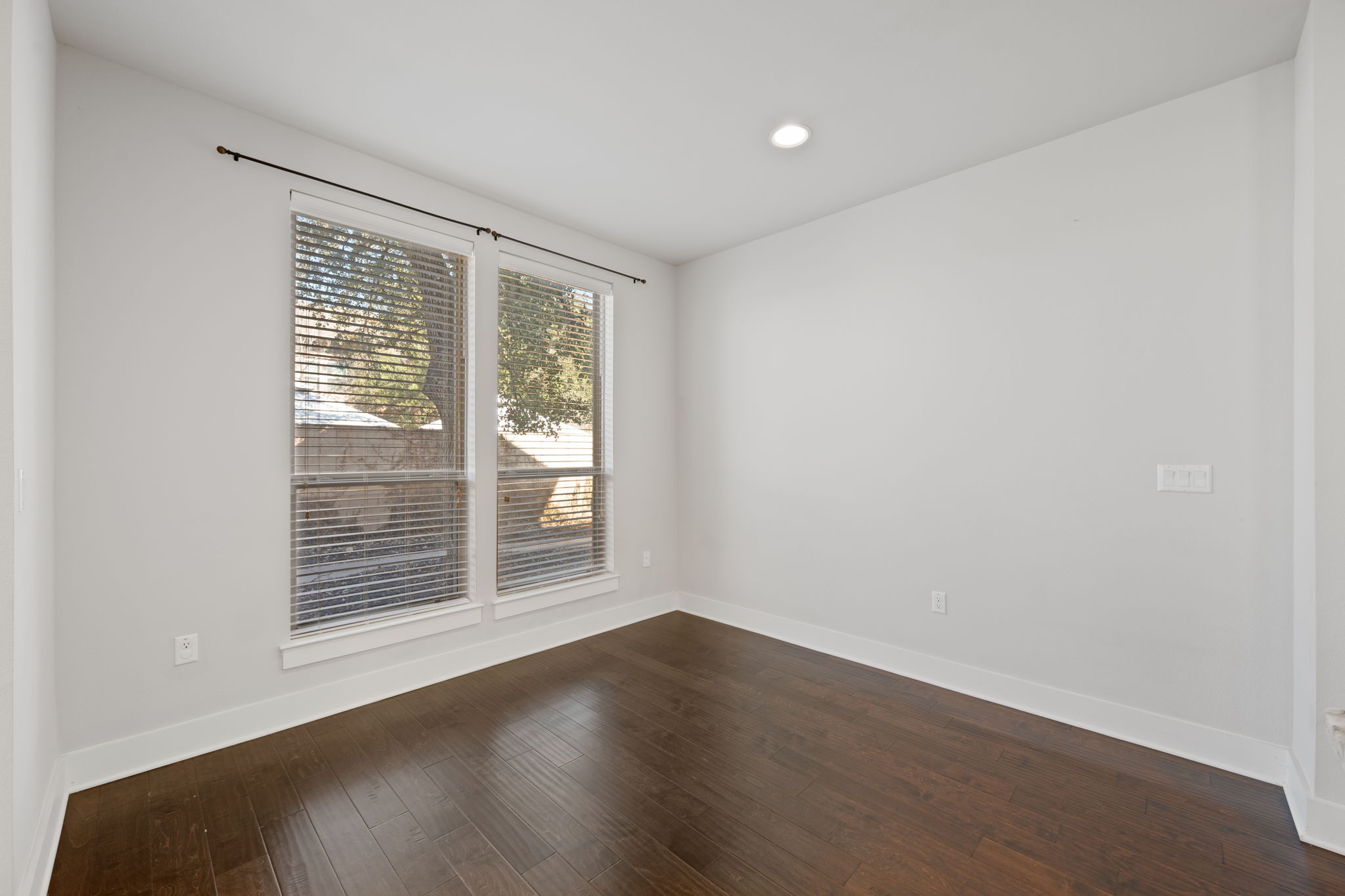 13800 Lyndhurst Street, Unit 326 Austin, TX 78717 - Photo 14 of 39 a view of an empty room with wooden floor and a window