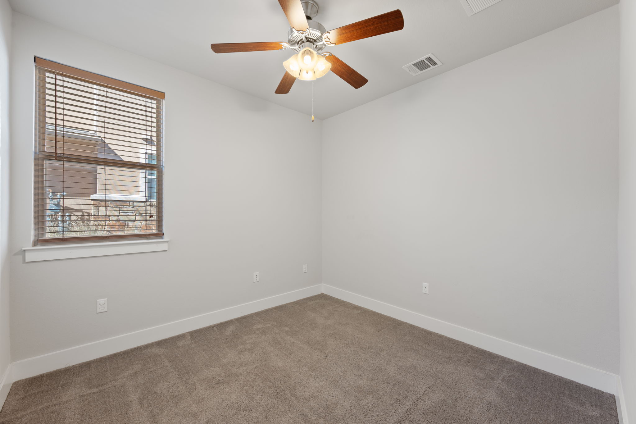 13800 Lyndhurst Street, Unit 326 Austin, TX 78717 - Photo 16 of 39 an empty room with a window and a fan