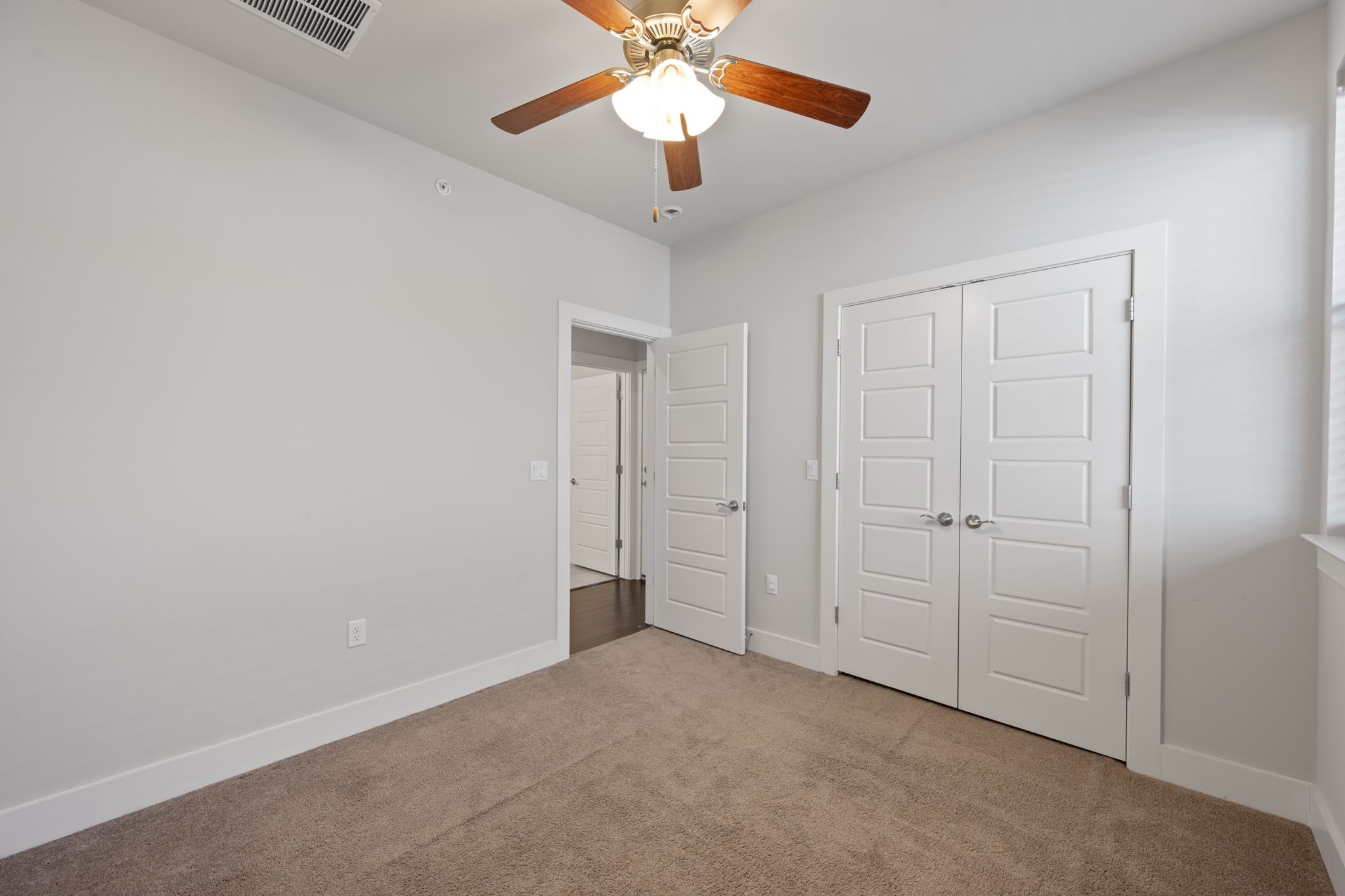13800 Lyndhurst Street, Unit 326 Austin, TX 78717 - Photo 17 of 39 a view of an empty room and chandelier fan