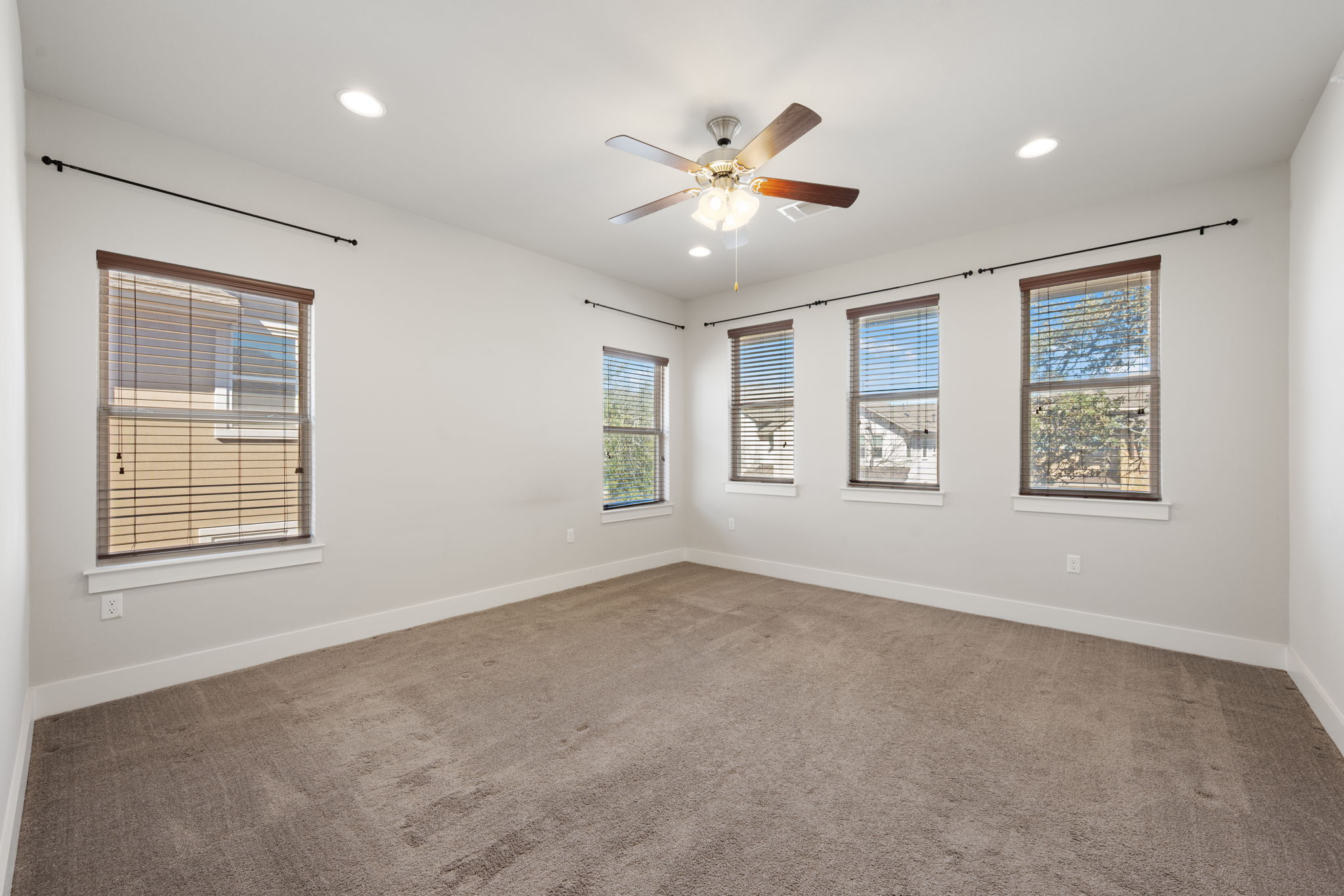 13800 Lyndhurst Street, Unit 326 Austin, TX 78717 - Photo 20 of 39 an empty room with windows and fan