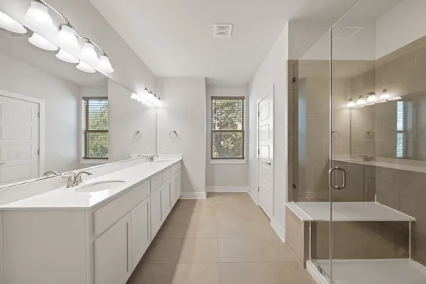 a bathroom with a shower tub and sink
