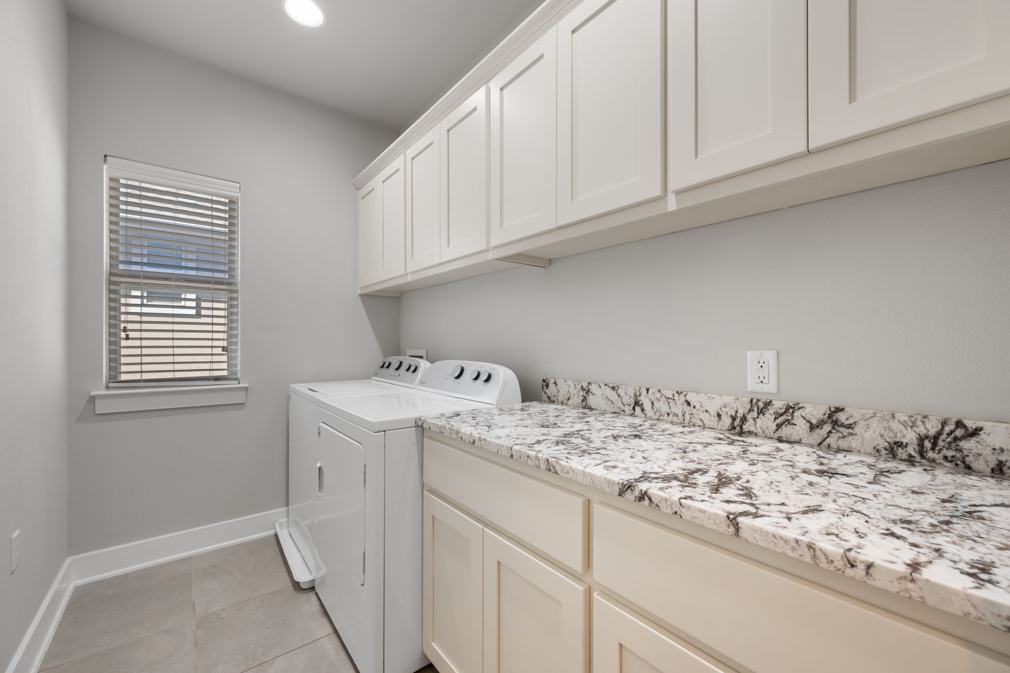 13800 Lyndhurst Street, Unit 326 Austin, TX 78717 - Photo 32 of 39 a utility room with stainless steel appliances granite countertop a sink and cabinets