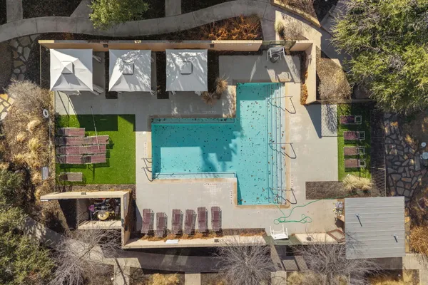a view of a swimming pool with a patio