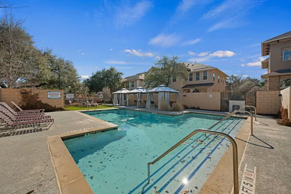 a view of a house with backyard porch and sitting area