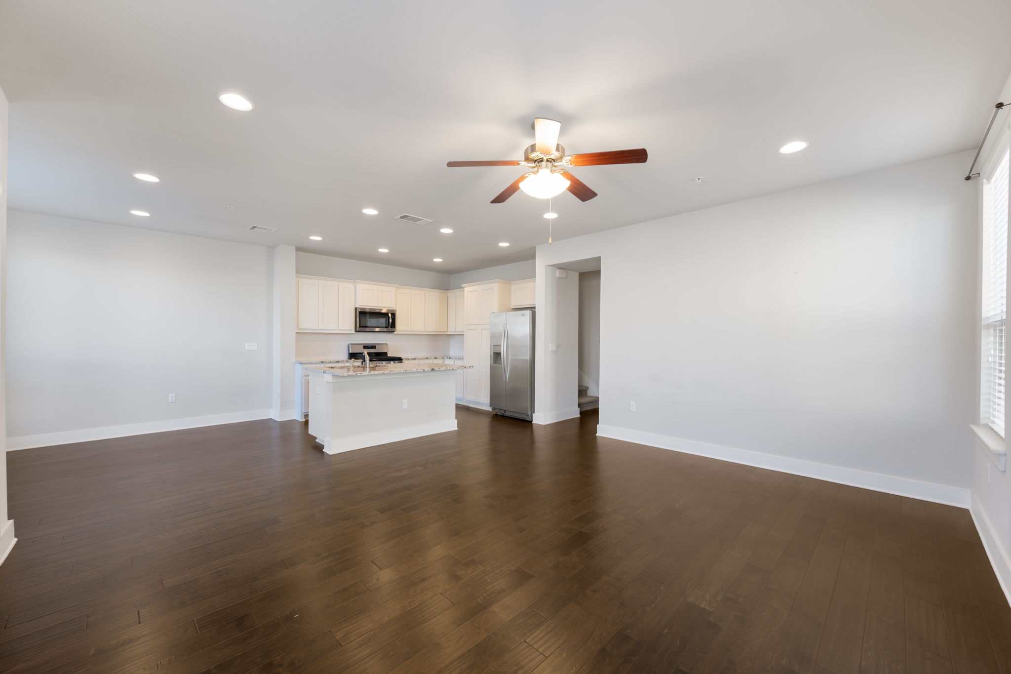13800 Lyndhurst Street, Unit 326 Austin, TX 78717 - Photo 8 of 39 a view of a kitchen with a sink and a refrigerator