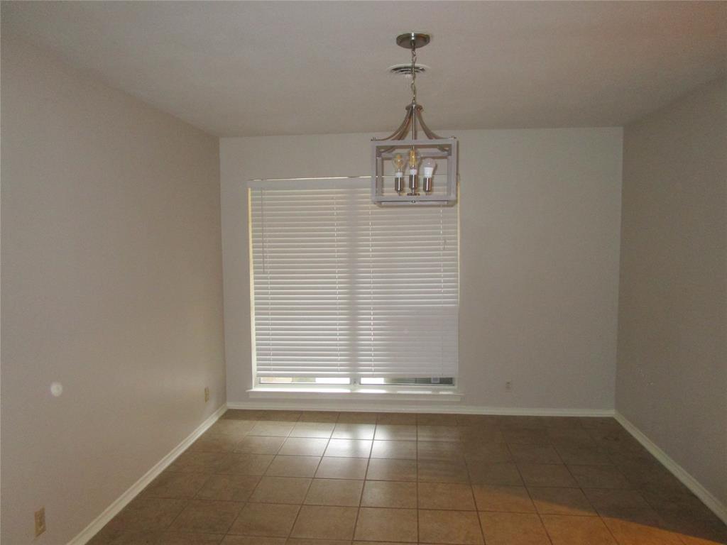 7128 Clemson Drive Dallas, TX 75214 - Photo 3 of 10 a view of a livingroom with a window