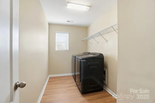 a view of a utility room with washer and dryer