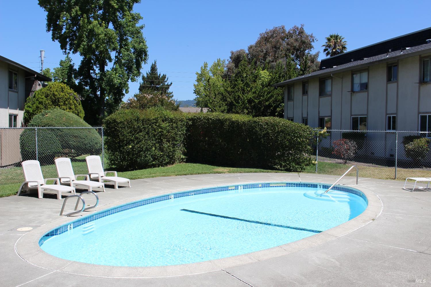 1347 Southwest Boulevard, Unit F Rohnert Park, CA 94928 - Photo 18 of 22 a view of a swimming pool with a patio