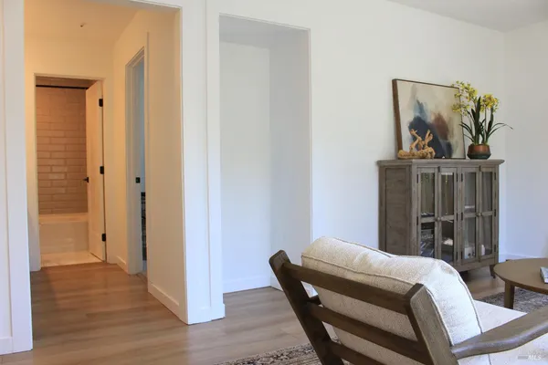 a bedroom with a bed and a mirror