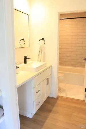 a bathroom with a sink a mirror and