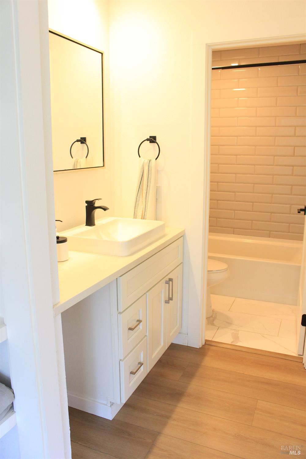 1347 Southwest Boulevard, Unit F Rohnert Park, CA 94928 - Photo 7 of 22 a bathroom with a sink a mirror and