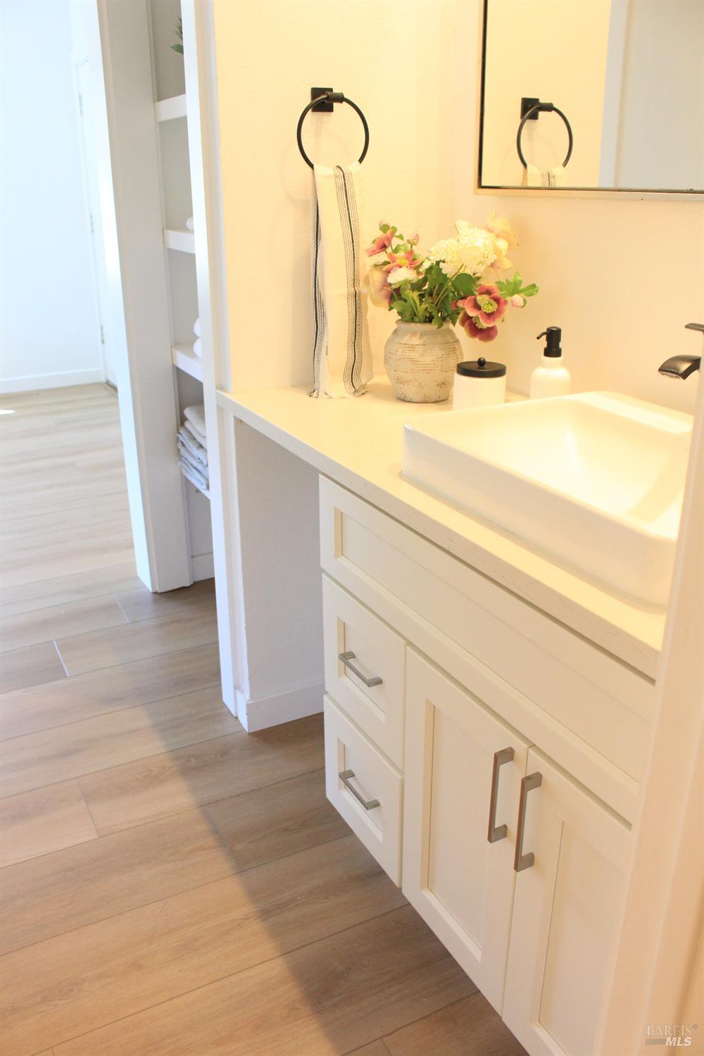 1347 Southwest Boulevard, Unit F Rohnert Park, CA 94928 - Photo 8 of 22 a bathroom with a sink and mirror