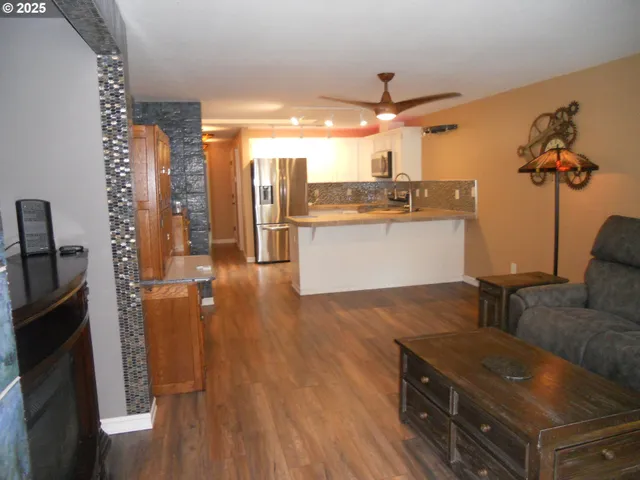 a kitchen with a sink appliances and cabinets