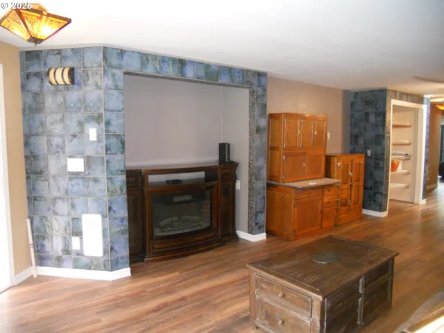 a kitchen with granite countertop a stove and a refrigerator