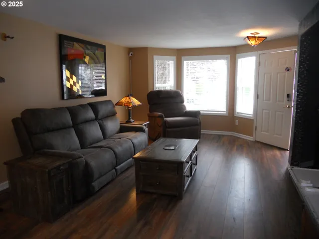 a living room with furniture and a window