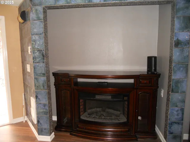 a stove top oven sitting inside of a kitchen