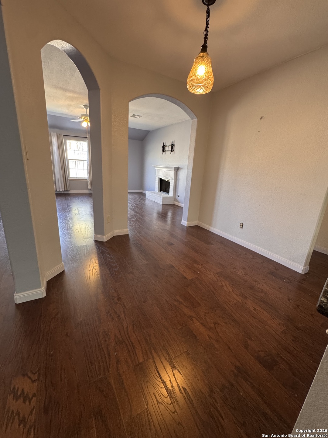 3836 Laurel Ridge Drive Round Rock, TX 78665 - Photo 13 of 40 wooden floor in an empty room with a window