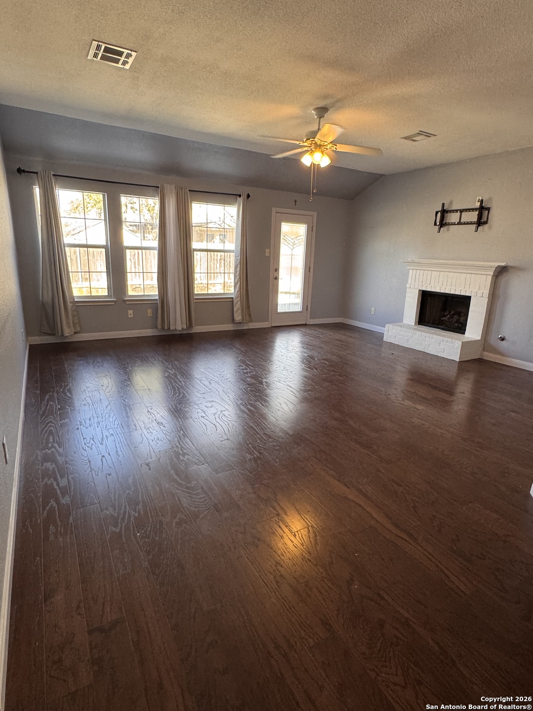 3836 Laurel Ridge Drive Round Rock, TX 78665 - Photo 14 of 40 wooden floor in an empty room with a window