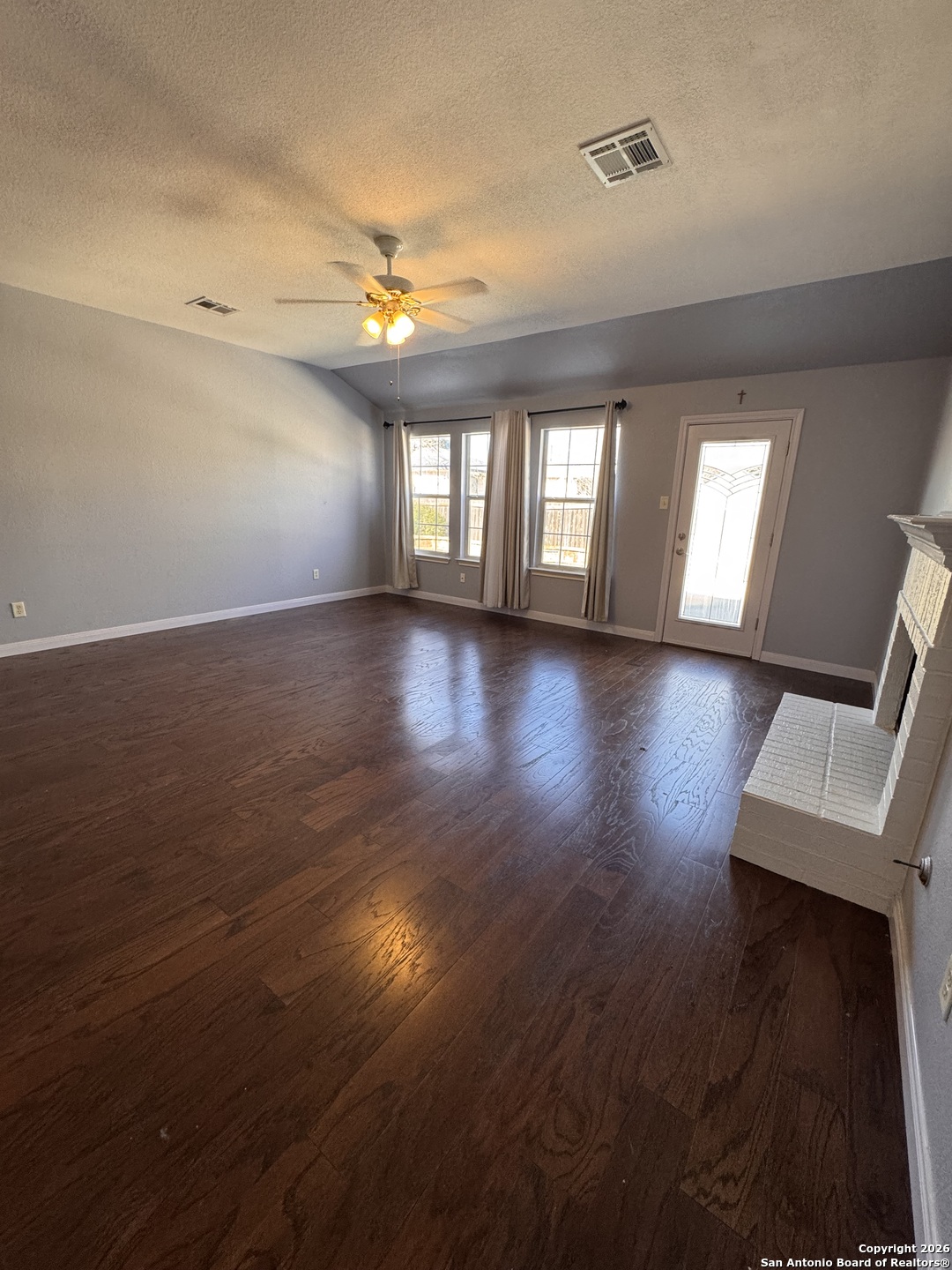 3836 Laurel Ridge Drive Round Rock, TX 78665 - Photo 17 of 40 an empty room with wooden floor and windows