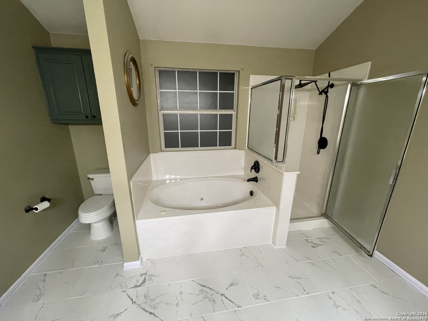 3836 Laurel Ridge Drive Round Rock, TX 78665 - Photo 24 of 40 a white bath tub sitting in a bathroom