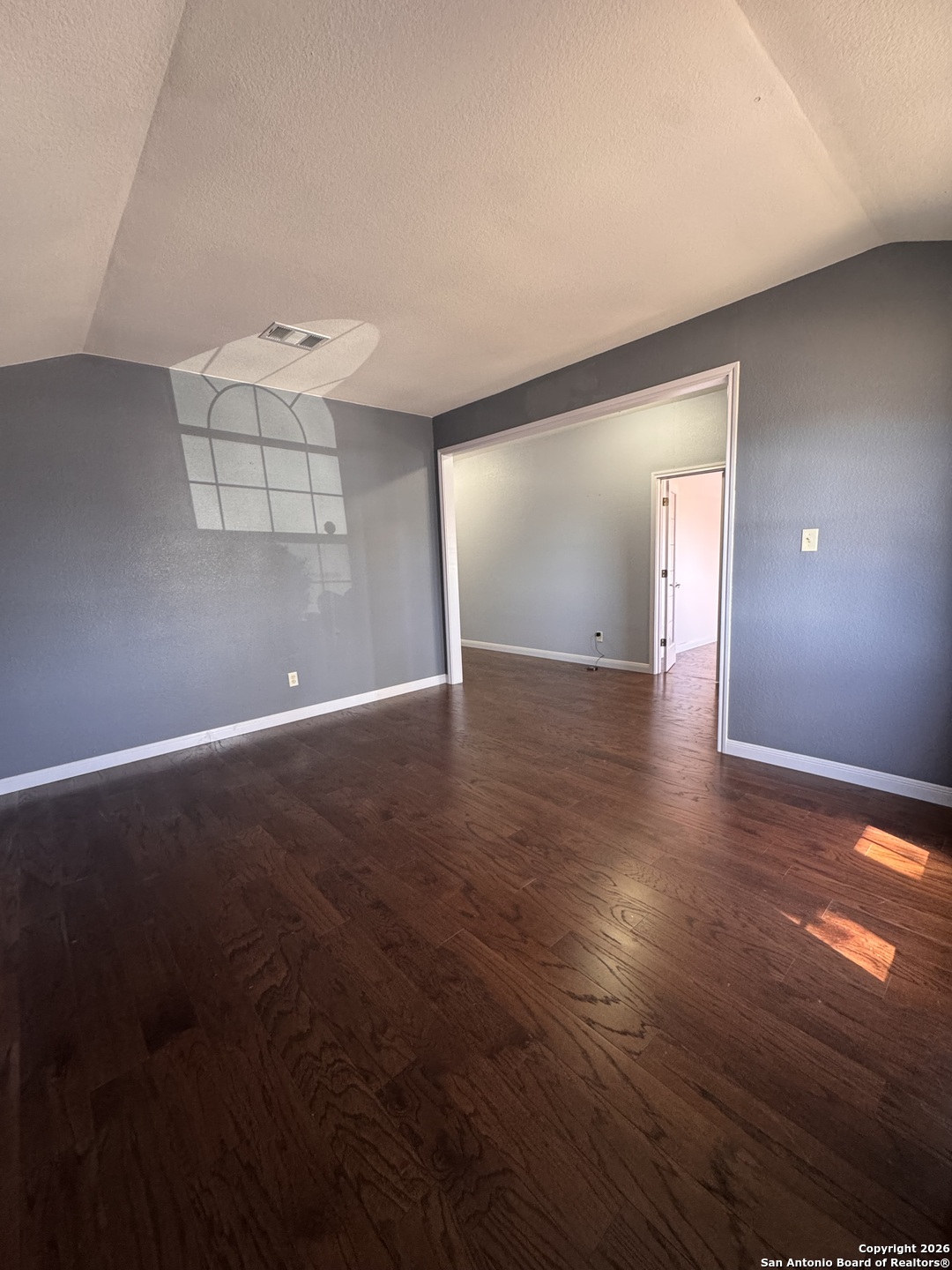 3836 Laurel Ridge Drive Round Rock, TX 78665 - Photo 26 of 40 an empty room with wooden floor and windows