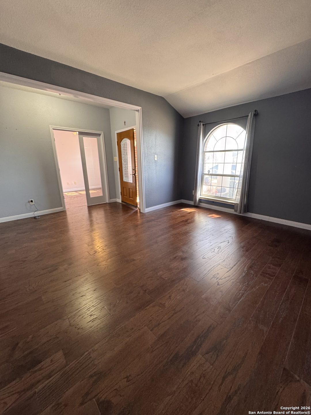 3836 Laurel Ridge Drive Round Rock, TX 78665 - Photo 27 of 40 an empty room with wooden floor and windows