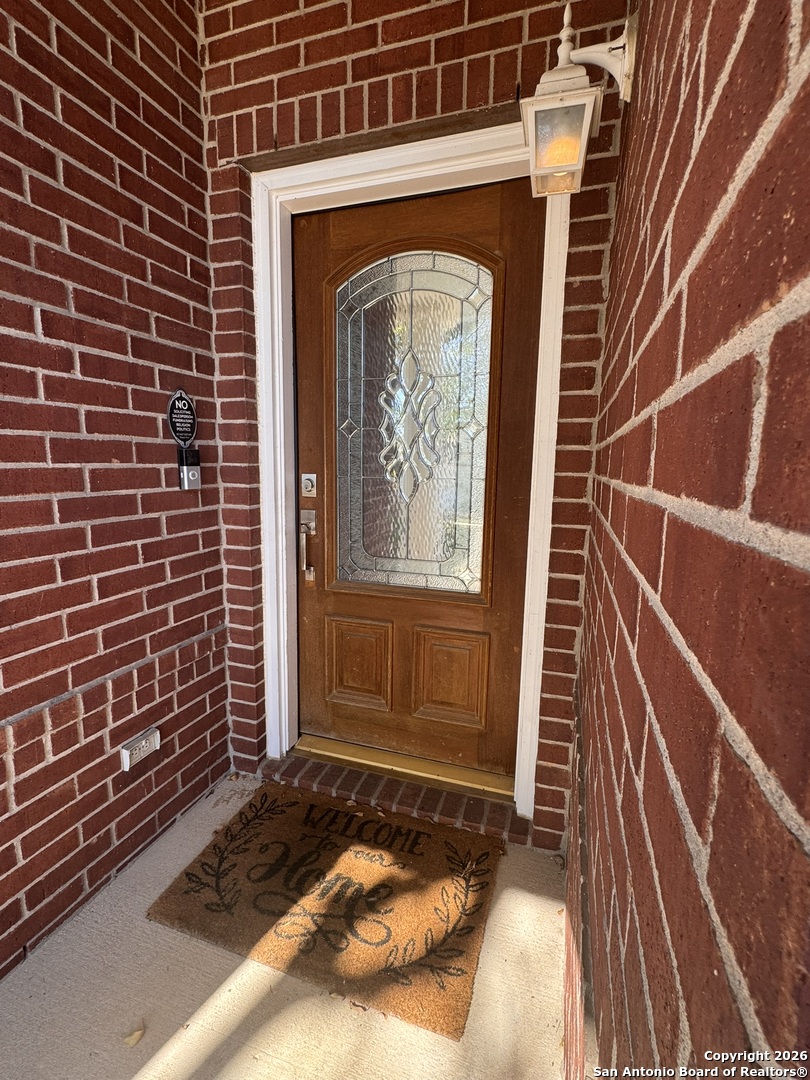 3836 Laurel Ridge Drive Round Rock, TX 78665 - Photo 3 of 40 a view of a door with brick walls