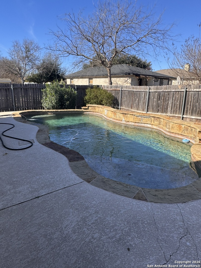 3836 Laurel Ridge Drive Round Rock, TX 78665 - Photo 37 of 40 a view of a swimming pool with a yard